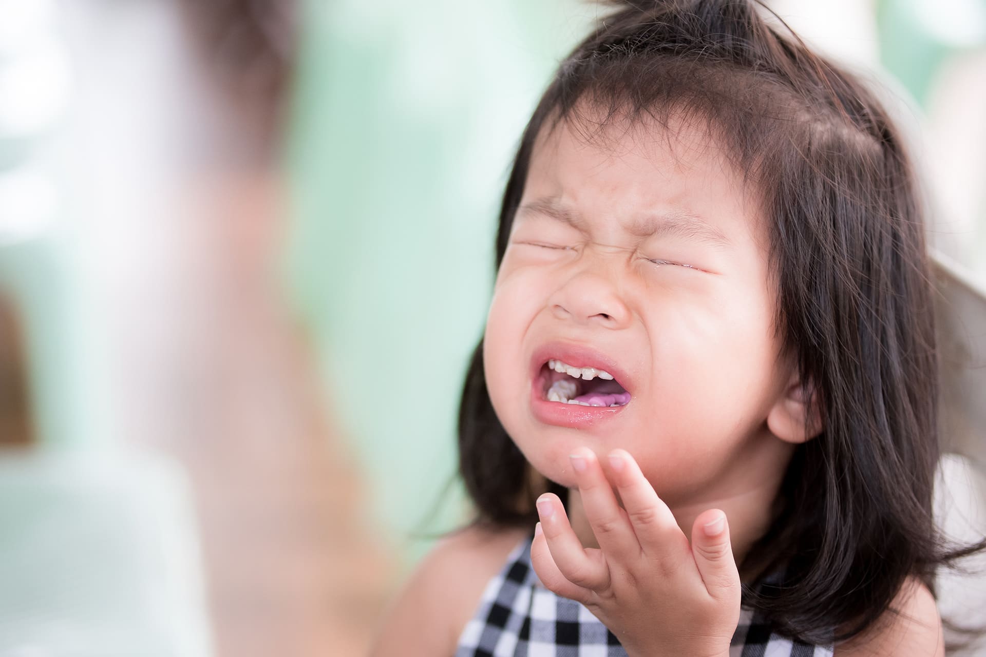 What to Do When a Baby Tooth Is Pushed Into the Gum After a Fall